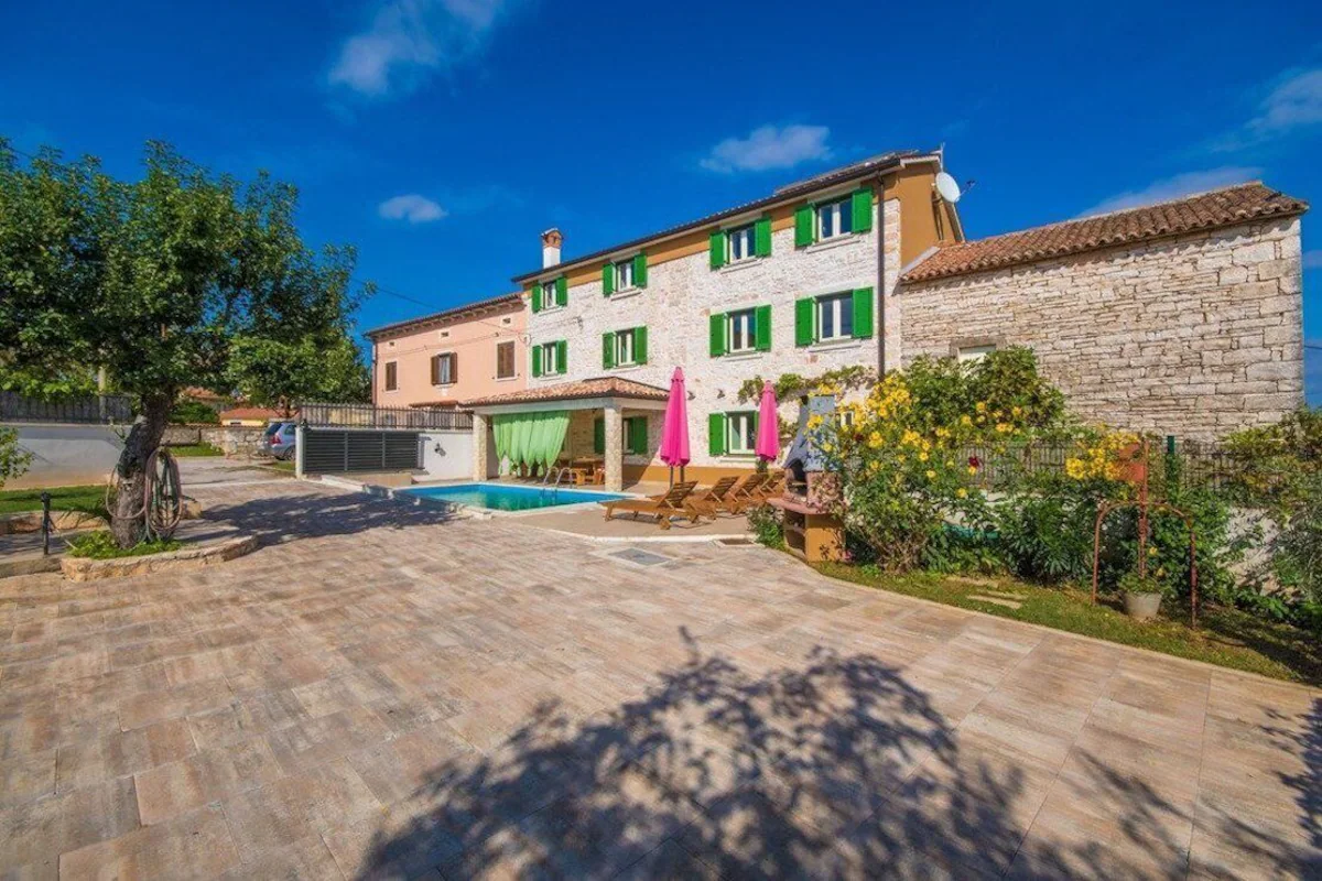 A stone villa with a private pool and paved terrace in Istria